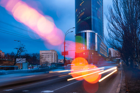 Night city traffic lights. Artistic photo of night traffic in the city with blurry light trailsの写真素材