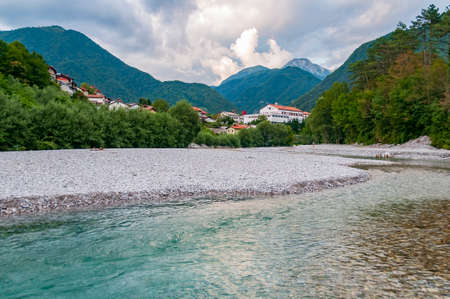 Beautiful mountain village and emerald river. Tolmin, Sloveniaの写真素材