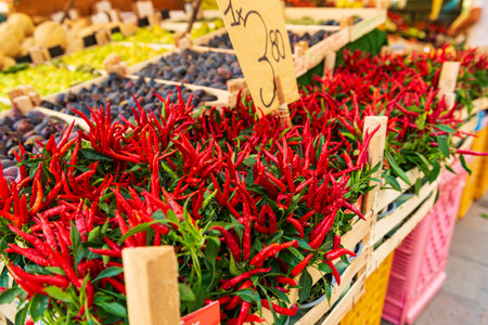 Red pepper on the street market shelves. Fresh red hot chili peppersの写真素材