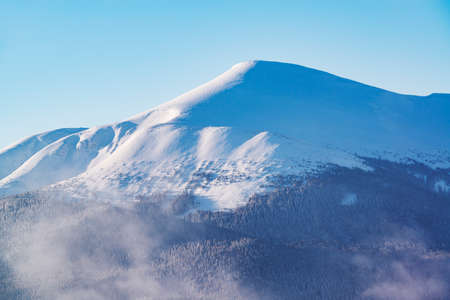 Beautiful view on a majestic mountain covered by snowの写真素材