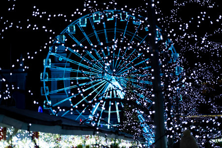 Ferris wheel at night with holiday illuminationの写真素材