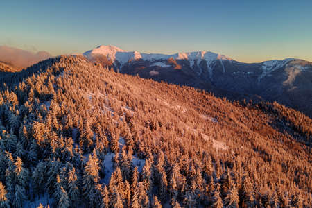 Magic view on marmaros mountain range illuminated by evening sun in winterの写真素材