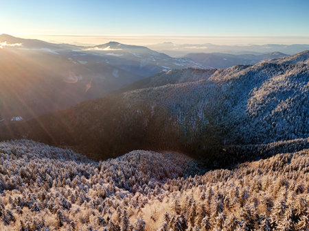 Wild winter mountains at sunriseの写真素材
