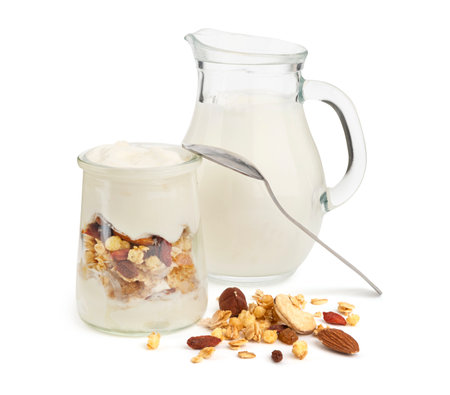 Healthy breakfast with milk, yogurt with granola and nutsの写真素材