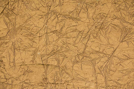 Cracked clay pattern. Creative unusual texture of raw clay wallの写真素材