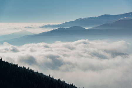 Scenic mountain cloudscape. Clouds in the winter mountain valley.の写真素材