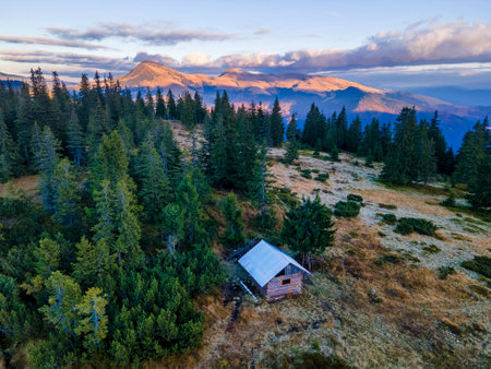Tiny wooden shelter lost in the mountains. Going into the wildの写真素材