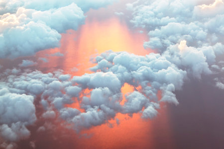 Aerial view, abstract sky background with sunset colored sea and cloudsの写真素材