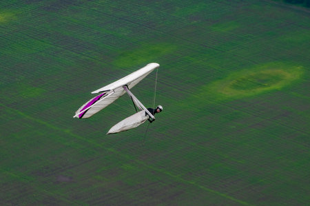 Hangglider wing in flight. Aerial photoの写真素材