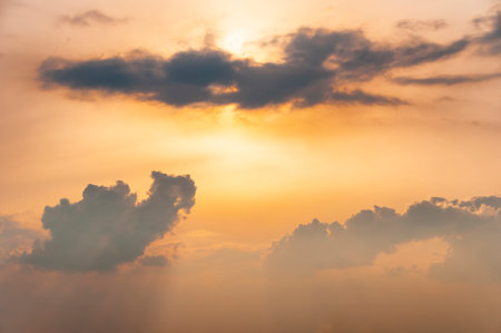 Hazy sunset sky with clouds and sun rays. Nature sky backgroundの写真素材