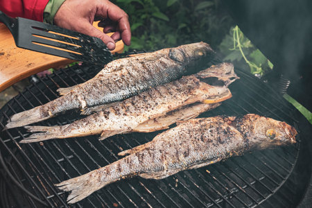 Delicious grilled fish on the barbeque grille. Summer BBQ partyの写真素材