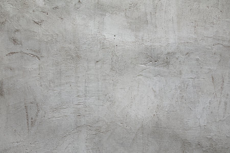 Real grunge plaster or concrete grey wall textureの写真素材