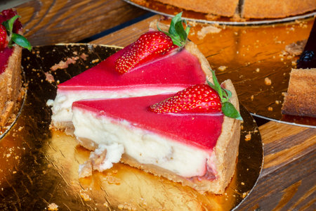 Delicious strawberry cheesecake on the plateの写真素材