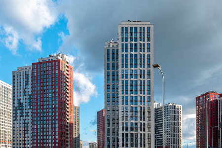 New high rise residential houses in a sunny day. Construction and development industry. House loan, mortgage businessの写真素材
