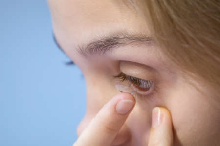 An eye lens that you hold on your fingers before putting on.の写真素材