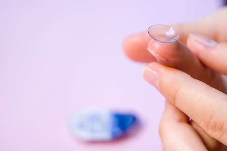An eye lens that you hold on your fingers before putting on.の写真素材