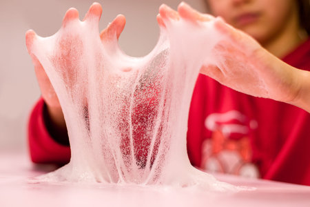 The girl stretches the slime.