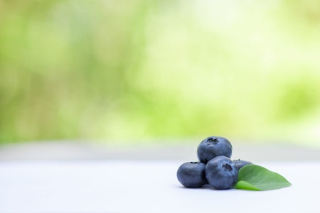 fresh ripe blueberries on the table in the garden. healthy eating, diet, vegetarian, organic food,...