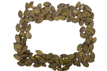 Pumpkin seeds isolated on white background. top view. Pumpkin seed frame.の写真素材