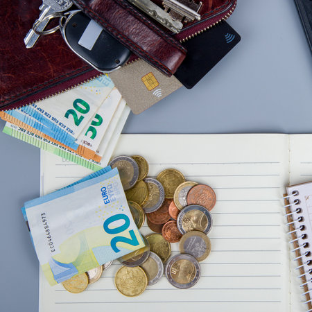 Euro banknotes, wallet and coins on the table. business conceptの写真素材
