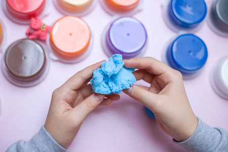 Children's hands molding clay. Early development of fine motor skills.の写真素材