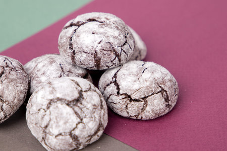 Chocolate cookies on a colored background. Selective focus.