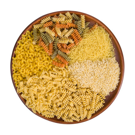 Variety of types and shapes of Italian pasta in a bowl.の写真素材