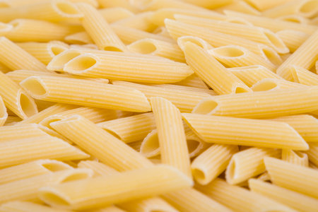 close up of a penne pasta texture background. italian pastaの写真素材