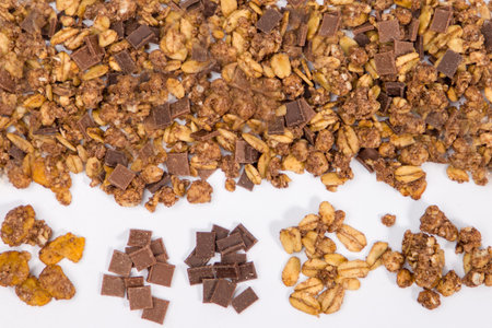 Chocolate granola on white background. Top view.