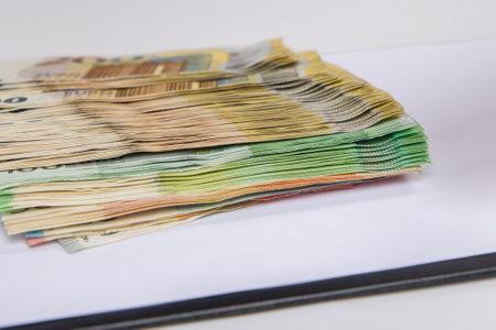 Euro banknotes stacked on a white background. Close-up.の写真素材
