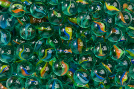 Colorful marbles as a background. Close-up shot. Top view.の写真素材