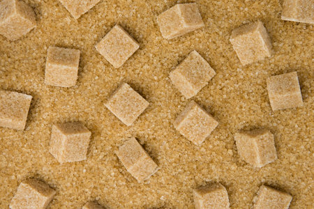 Brown sugar cubes background. Top view. Flat lay. Copy space.の写真素材