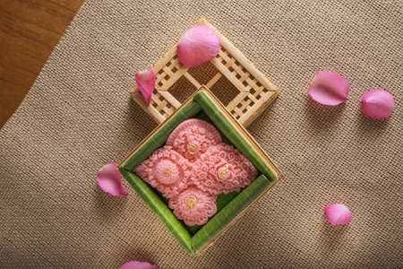 Royal Thai cuisine  Thai desserts Pink-gold flowers sweetmeat 
Famous auspicious desserts for celebration Thai tradition wedding party.の写真素材