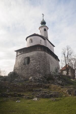 Mali grad or Small castle in Kamnik, Slovenia. One of the most famous landmarks in the old city center. Church build on top of a small hill in Kamnik.の写真素材