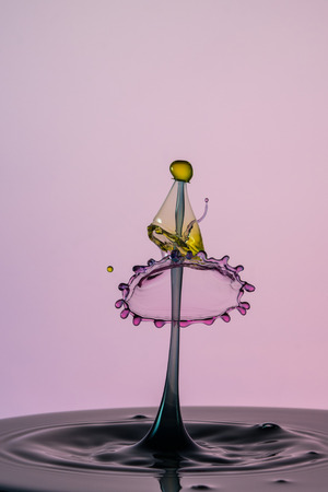 An abstract macro shot of a water drop collision.の写真素材