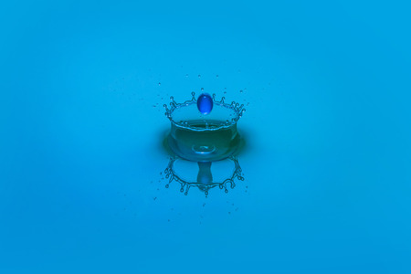 An abstract macro shot of a water drop collision.の写真素材