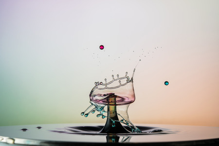 water drop collision on a wet backgroundの写真素材