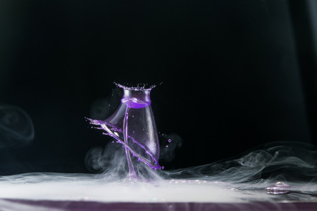 water drop collision on a wet backgroundの写真素材