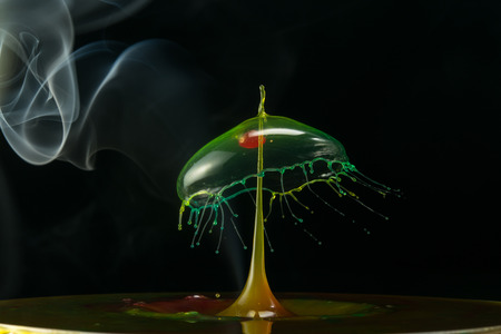 water drop collision on a wet backgroundの写真素材