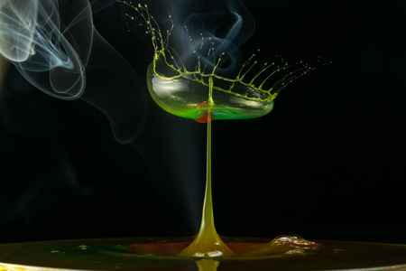 water drop collision on a wet backgroundの写真素材