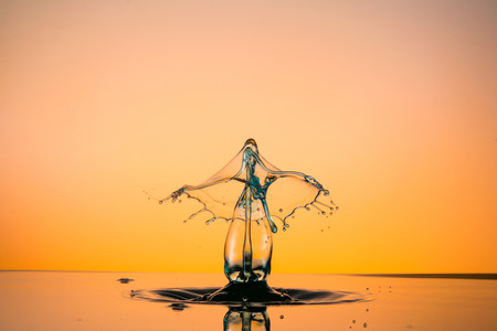 water drop collision on a wet backgroundの写真素材