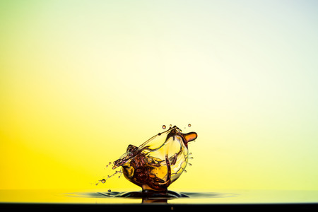 water drop collision on a wet backgroundの写真素材