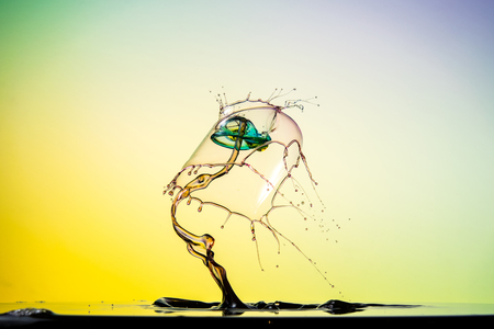 water drop collision on a wet backgroundの写真素材