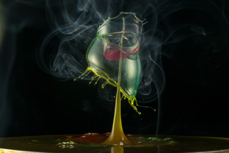 water drop collision on a wet backgroundの写真素材