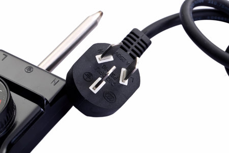 Black electric cable isolated on white backgroundのeditorial素材