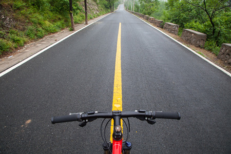 The rugged mountain road is shrouded in haze in Beijing, Chinaの写真素材