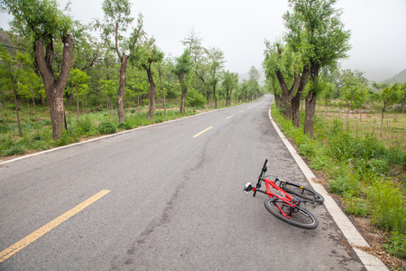 The rugged mountain road is shrouded in haze in Beijing, Chinaの写真素材