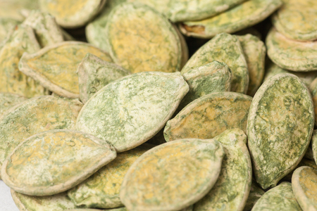 Pumpkin seeds isolated on white backgroundの写真素材