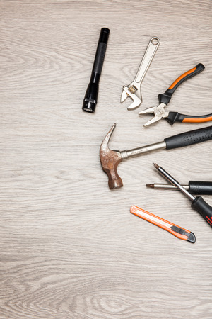 The repair tools is placed on the wooden table.の写真素材