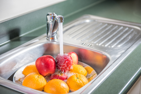 Washing fruitsの写真素材
